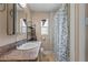 Bathroom featuring a shower/tub combination, vanity, mirror, and window at 207 Rose St, Auburndale, FL 33823