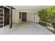 Covered carport featuring the front door entrance and number 207 at 207 Rose St, Auburndale, FL 33823