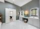 Elegant bathroom featuring dual vanities, marble floors, and access to the primary bedroom at 2147 Whitfield Ln, Orlando, FL 32835