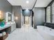 Elegant bathroom featuring dual vanities, marble floors, and a luxurious soaking tub at 2147 Whitfield Ln, Orlando, FL 32835