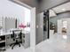 Modern bathroom features a walk-in shower, soaking tub, vanity, and neutral color palette at 2147 Whitfield Ln, Orlando, FL 32835