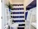 Nautical themed bathroom features blue and white striped shower curtain and a wooden whale decoration on the wall at 2147 Whitfield Ln, Orlando, FL 32835