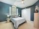 Comfortable bedroom with neutral carpet, large window, and a white comforter at 2147 Whitfield Ln, Orlando, FL 32835