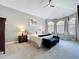 Primary bedroom featuring high ceilings, carpet floors, arched windows, and sitting area at 2147 Whitfield Ln, Orlando, FL 32835