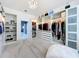 Large walk-in closet with custom shelving, drawers, shoe racks, and ample storage space at 2147 Whitfield Ln, Orlando, FL 32835