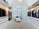 Spacious walk-in closet with custom shelving, hanging space, and ample natural light at 2147 Whitfield Ln, Orlando, FL 32835