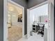 Spacious walk-in closet with a vanity desk, custom shelving, and ample natural light at 2147 Whitfield Ln, Orlando, FL 32835