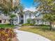 Charming two-story home with lush landscaping, mature trees and inviting curb appeal at 2147 Whitfield Ln, Orlando, FL 32835