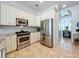 Bright kitchen featuring stainless steel appliances and stylish countertops at 2147 Whitfield Ln, Orlando, FL 32835