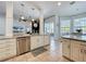 Open concept kitchen with stainless steel appliances and large island at 2147 Whitfield Ln, Orlando, FL 32835