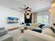Bright and airy living room featuring fireplace, hardwood floors, and a view of the pool at 2147 Whitfield Ln, Orlando, FL 32835