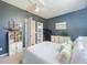 Relaxing bedroom featuring a large window and neutral color tones offering a warm and inviting living space at 2147 Whitfield Ln, Orlando, FL 32835