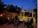 Backyard patio area with outdoor seating and soft, ambient lighting at 2147 Whitfield Ln, Orlando, FL 32835