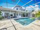 Gorgeous screened-in pool with ample patio space perfect for entertaining or relaxing outdoors at 2147 Whitfield Ln, Orlando, FL 32835
