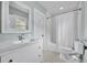 Clean bathroom with white fixtures and black and white floors at 216 E Vanderbilt St, Orlando, FL 32804