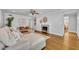 Spacious living room featuring a decorative fireplace, hardwood floors, comfortable seating, and stylish decor at 216 E Vanderbilt St, Orlando, FL 32804