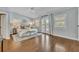 Bright main bedroom boasts french doors, wooden floors, and a modern ceiling fan at 216 E Vanderbilt St, Orlando, FL 32804