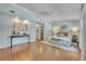Serene bedroom with hardwood floors, a walk-in closet, a ceiling fan, and soft, neutral decor at 216 E Vanderbilt St, Orlando, FL 32804