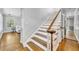 Traditional staircase with dark wood and white trim at 216 E Vanderbilt St, Orlando, FL 32804