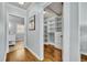 Well-organized walk-in closet with custom shelving and drawers provides ample storage space at 216 E Vanderbilt St, Orlando, FL 32804