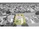 Drone view of a house bordered by yellow, with landscaping, and in a golf community at 2192 Kerwood Loop, The Villages, FL 32162