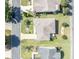 Bird's-eye view of home showcasing a manicured yard, driveway, and neighborhood surroundings at 2192 Kerwood Loop, The Villages, FL 32162