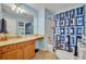 Bright bathroom with a vanity, large mirror, and a tub-shower combination at 2192 Kerwood Loop, The Villages, FL 32162
