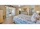Spacious bedroom featuring sliding glass doors to a sunroom and a view of the outdoors at 2192 Kerwood Loop, The Villages, FL 32162