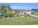 Well-maintained single-story home with lush landscaping and a welcoming curb appeal at 2192 Kerwood Loop, The Villages, FL 32162