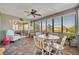Inviting sunroom with large windows and a ceiling fan, perfect for relaxing or entertaining at 2192 Kerwood Loop, The Villages, FL 32162