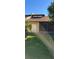 Home showcasing a backyard with lush lawn, screened in patio, and garage access at 2218 Abbey Rd, Winter Haven, FL 33880
