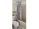 Bathroom with classic bathtub and shower combination, plus a functional built-in cabinet at 2218 Abbey Rd, Winter Haven, FL 33880