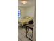 Bedroom with large window provides natural light, complemented by stylish desk and chair at 2218 Abbey Rd, Winter Haven, FL 33880