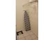 Functional closet with shelving and an ironing board, perfect for storage and organization at 2218 Abbey Rd, Winter Haven, FL 33880