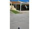 Charming townhouse with a covered carport and well-maintained front yard at 2218 Abbey Rd, Winter Haven, FL 33880