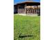 A beautiful wooden gazebo set in lush green grass at 2218 Abbey Rd, Winter Haven, FL 33880