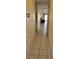 Inviting hallway with tiled flooring leading to the living area at 2218 Abbey Rd, Winter Haven, FL 33880