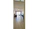 Inviting living room with tile flooring, sliding glass doors, and a ceiling fan for added comfort at 2218 Abbey Rd, Winter Haven, FL 33880
