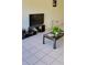 Bright living room with ceramic tile, a sleek TV stand, and a modern marble-topped coffee table at 2218 Abbey Rd, Winter Haven, FL 33880