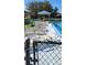 Community pool with a covered gazebo and lounge chairs on a sunny day at 2218 Abbey Rd, Winter Haven, FL 33880