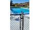 Community pool featuring refreshing blue water and secure perimeter fencing at 2218 Abbey Rd, Winter Haven, FL 33880