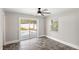 Bright bedroom with tile floors, sliding glass doors to the pool, and large windows at 2314 Meadowbrook St, Kissimmee, FL 34744