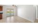 Bright dining area featuring tile floors, patio doors, and views of the pool at 2314 Meadowbrook St, Kissimmee, FL 34744