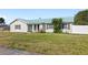 Charming home with manicured lawn, rustic shutters, and a metal roof at 2314 Meadowbrook St, Kissimmee, FL 34744