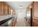 Bright kitchen with granite countertops, stainless steel appliances, and tile flooring at 2314 Meadowbrook St, Kissimmee, FL 34744
