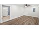 Bright room with vinyl floors, white walls, and access to the front door at 2314 Meadowbrook St, Kissimmee, FL 34744