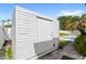 Backyard storage shed providing additional outdoor space, with view of pool in the background at 2314 Meadowbrook St, Kissimmee, FL 34744