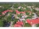 An aerial view shows the red roofs of the community buildings surrounded by lush greenery and parking areas at 232 Afton Sq # 201, Altamonte Springs, FL 32714