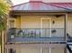 A welcoming condo balcony with comfortable seating and attractive potted plants at 232 Afton Sq # 201, Altamonte Springs, FL 32714