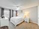 Comfortable bedroom features a ceiling fan and abundant natural light at 232 Afton Sq # 201, Altamonte Springs, FL 32714